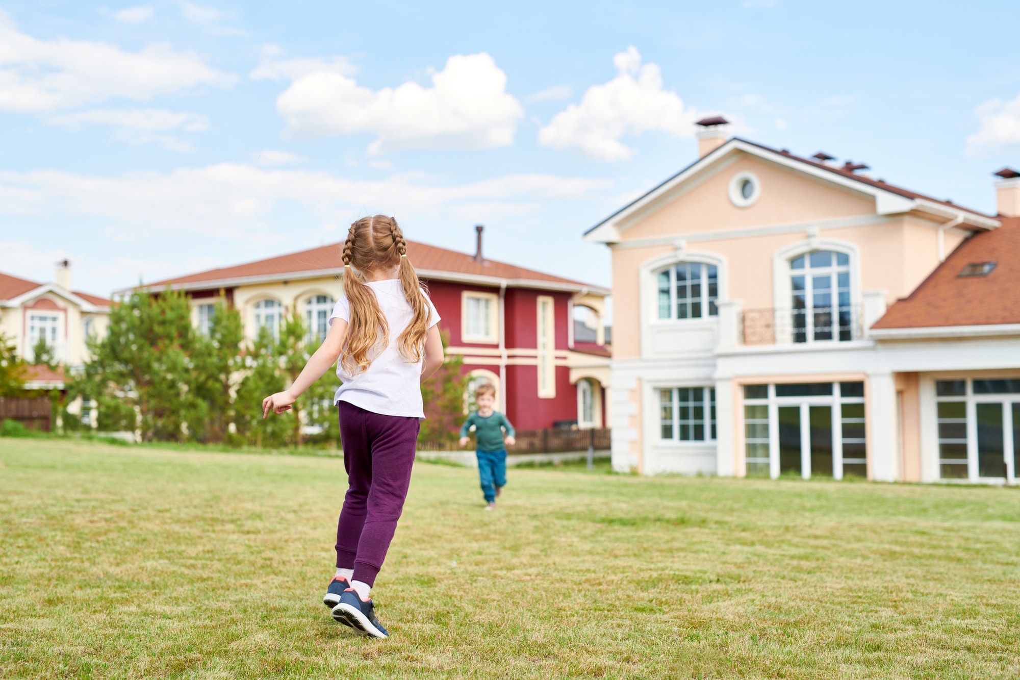 Two of Children Playing in Front Yard