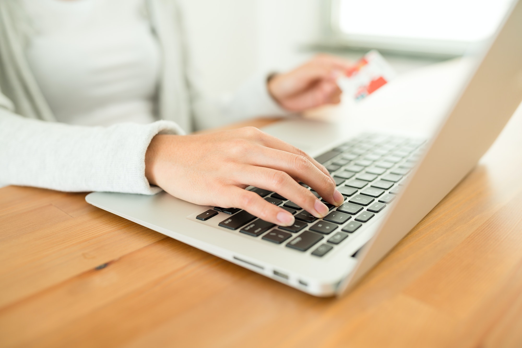 Woman using credit card for online shopping